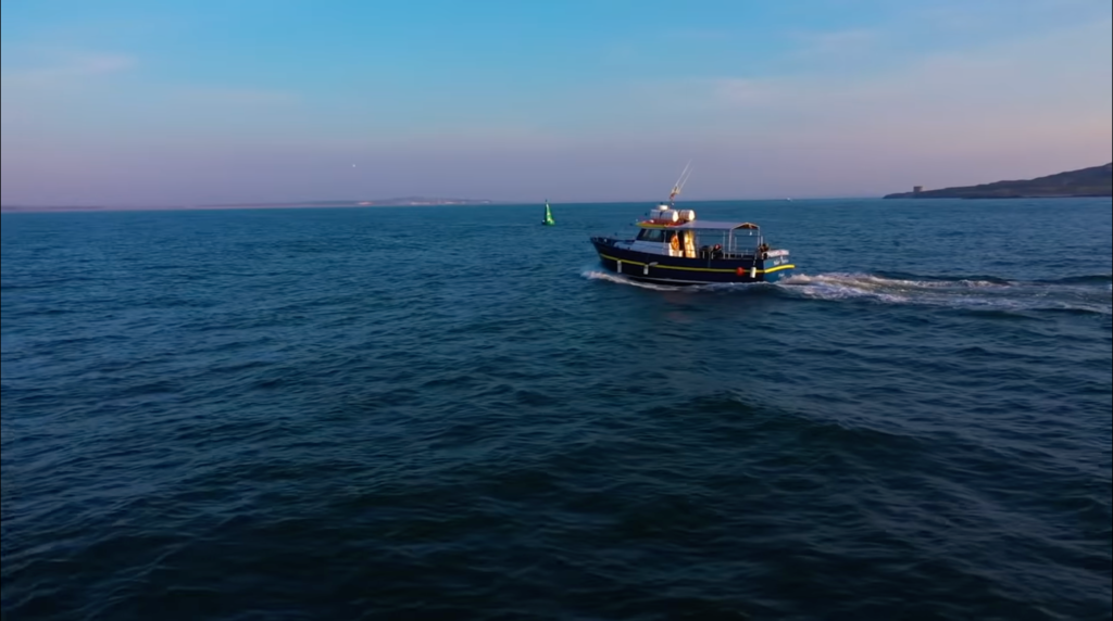 Boat on Sunrise over Howth on Howth Cliff Cruise