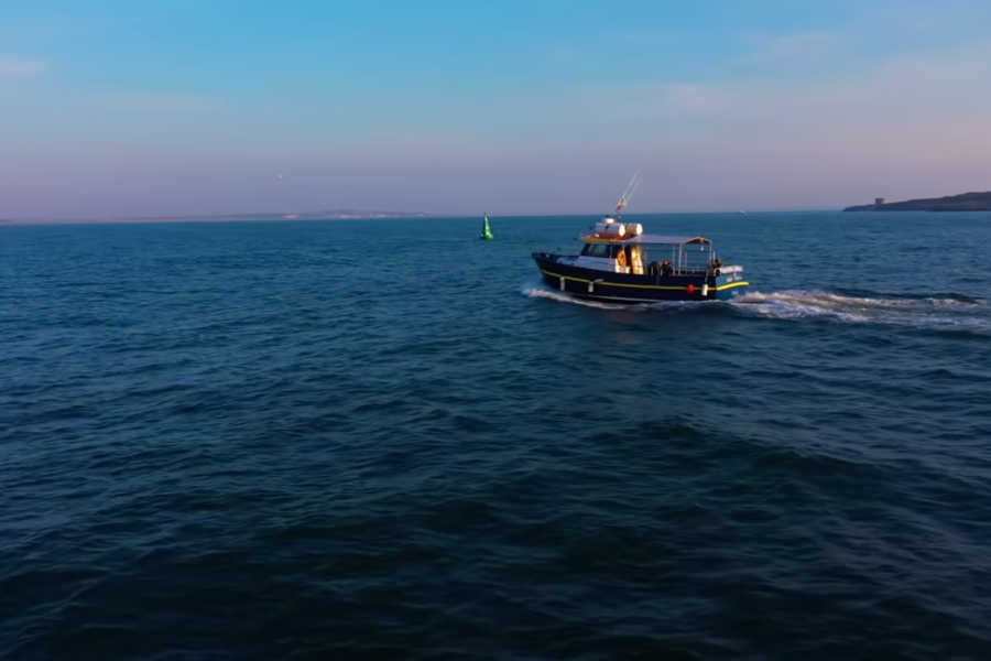 Boat on Sunrise over Howth on Howth Cliff Cruise